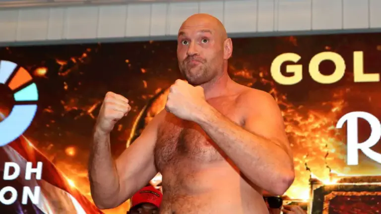 Two Muay Thai fighters competing in a ring with Max Muay Thai branding and a large digital backdrop.